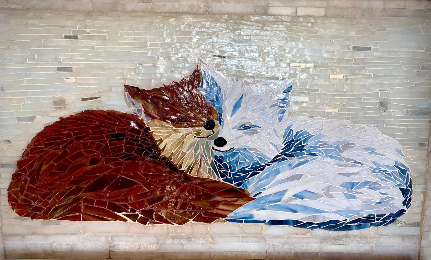 Fox Splash: a stained glass mosaic of a red fox and an arctic fox curled up together