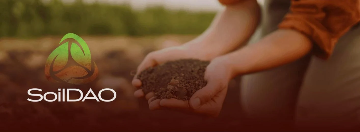 SoilDAO: the green and terracotta logo beside hands holding rich soil